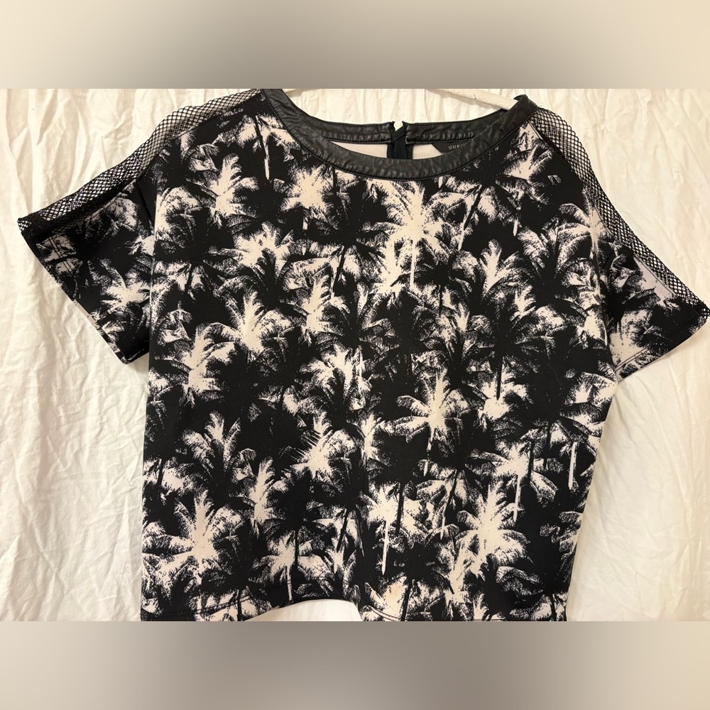 Guess black and white, netted arms faux leather top. Women’s size medium.
